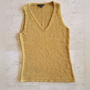 August Silk tunic length sleeveless acrylic and nylon sweater.
